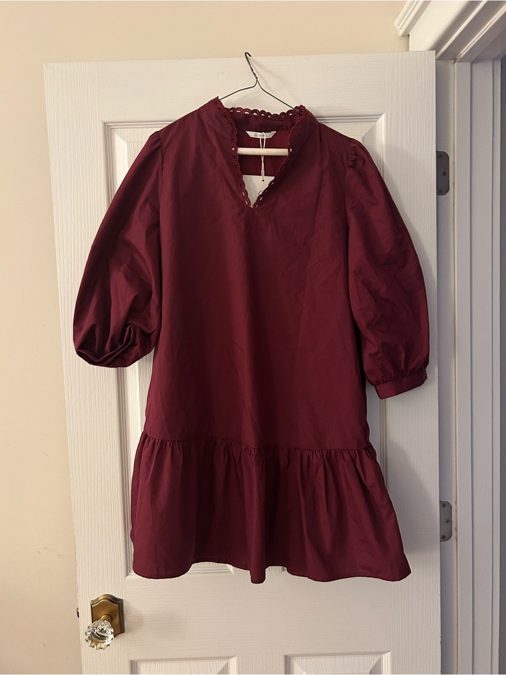 Cicy Bell lined burgundy dress with puff sleeves and ruffle around bottom